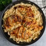 Chicken fettuccine alfredo in a skillet.