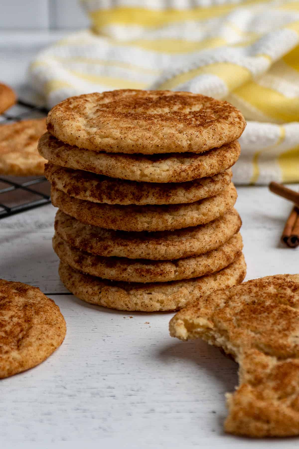 Close up of snickerdoodles stacked on top of each other.