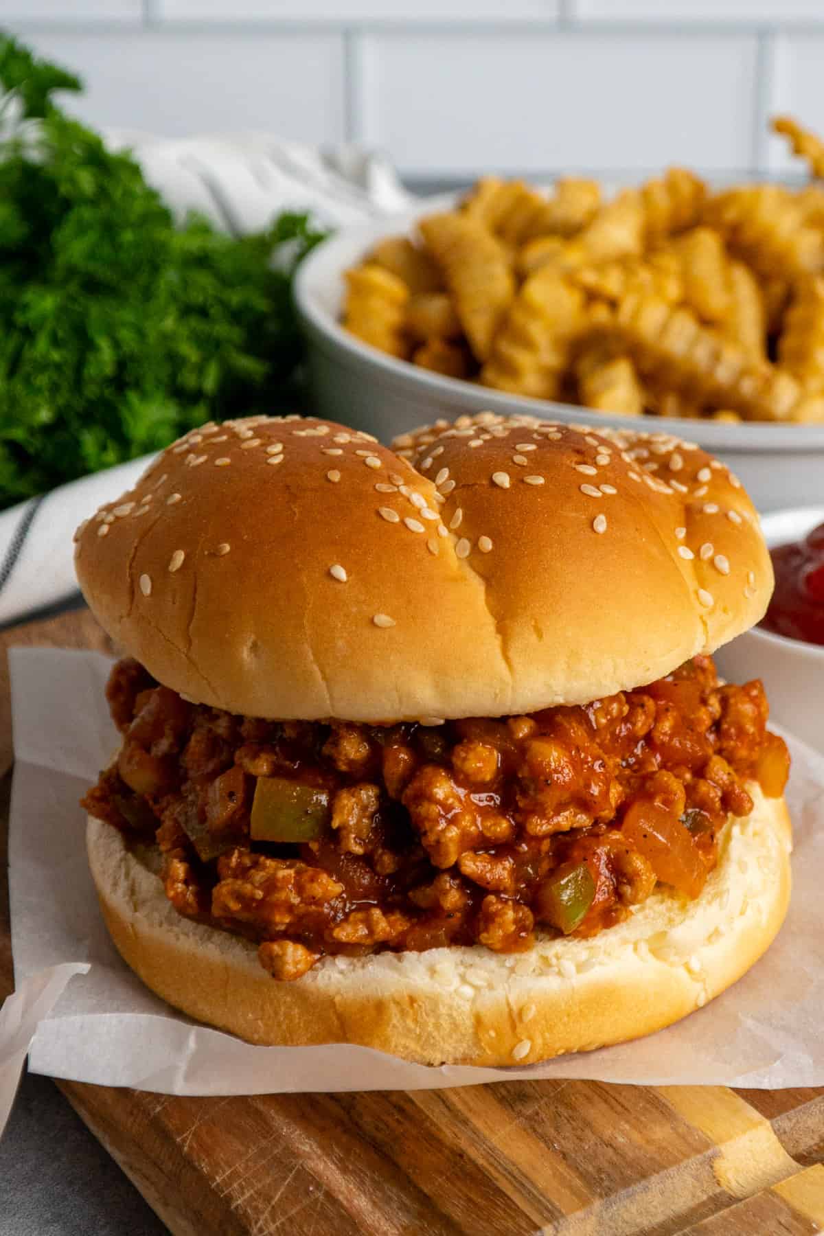 Healthy turkey sloppy Joes on a piece of parchment paper