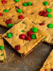 M&M cookie bars cut out on a sheet pan.