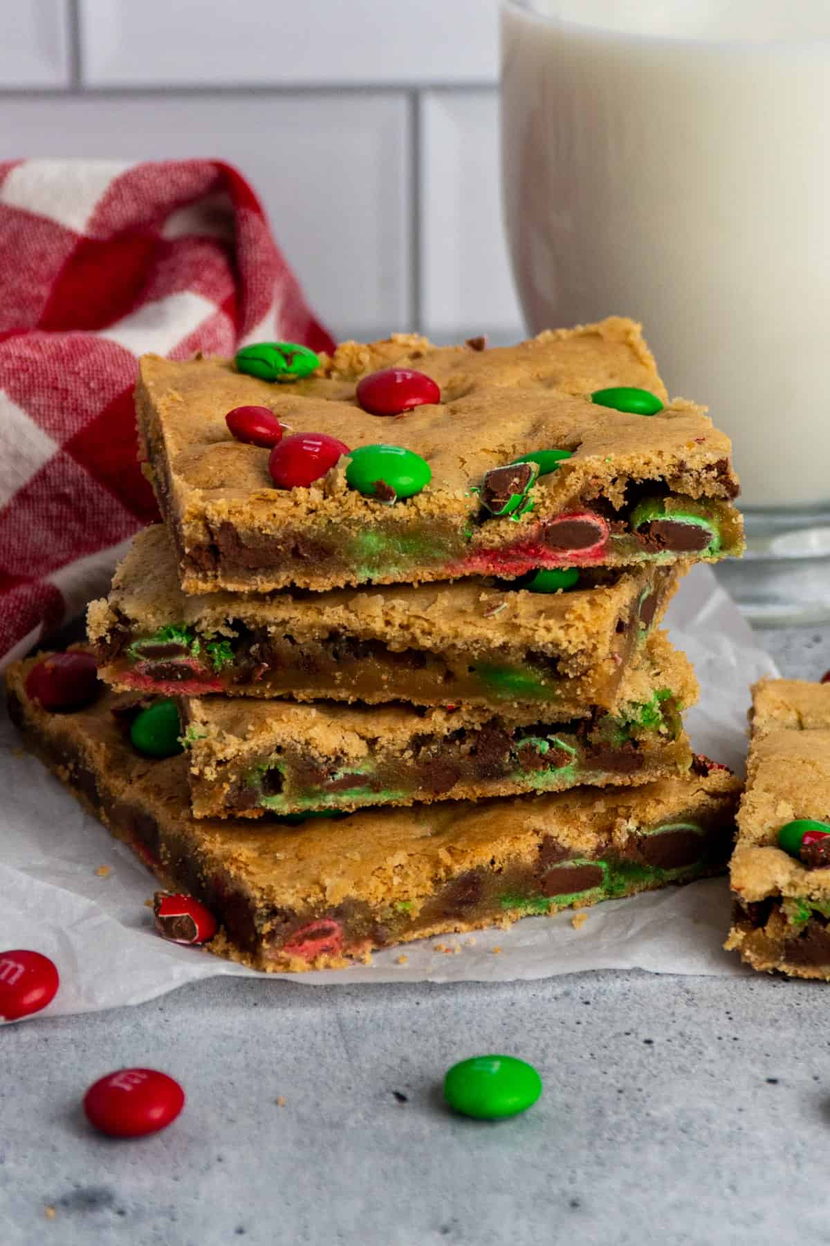 M&M cookie bars stacked on top of each other.