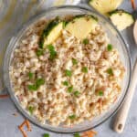 Hawaiian macaroni salad in a clear bowl garnished with pineapple.