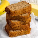 The best banana bread recipe sliced and stacked on top of each other.