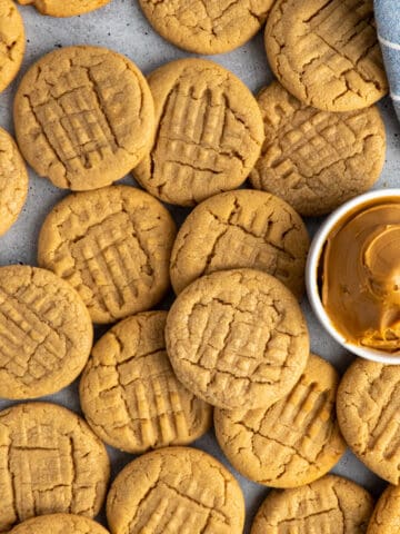 Overhead look at classic peanut butter cookies stacked on top of each other.