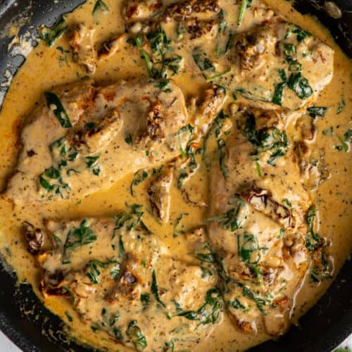 Creamy Tuscan garlic chicken in a skillet.