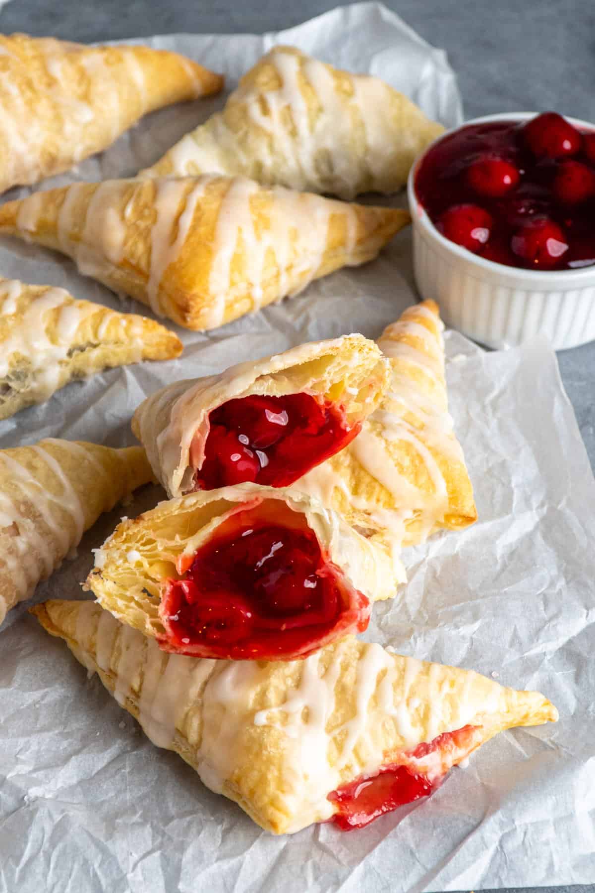Close up of homemade cherry turnovers cut in half.