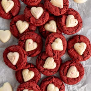 Red velvet cake mix cookies on a piece of parchment paper.