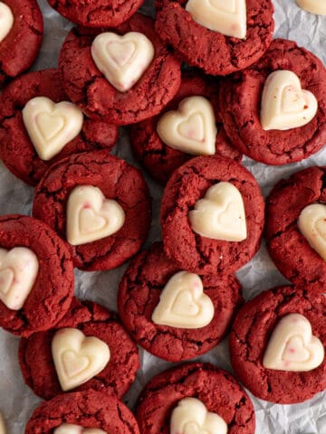 Red velvet cake mix cookies on a piece of parchment paper.