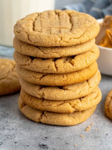 Seven peanut butter cookies stacked on top of each other.