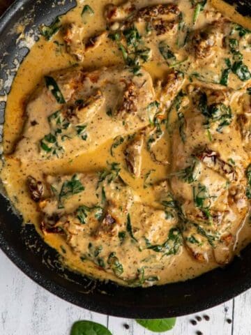 Creamy Tuscan garlic chicken in a skillet.