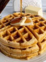 The best homemade waffle recipe with syrup being poured on it.