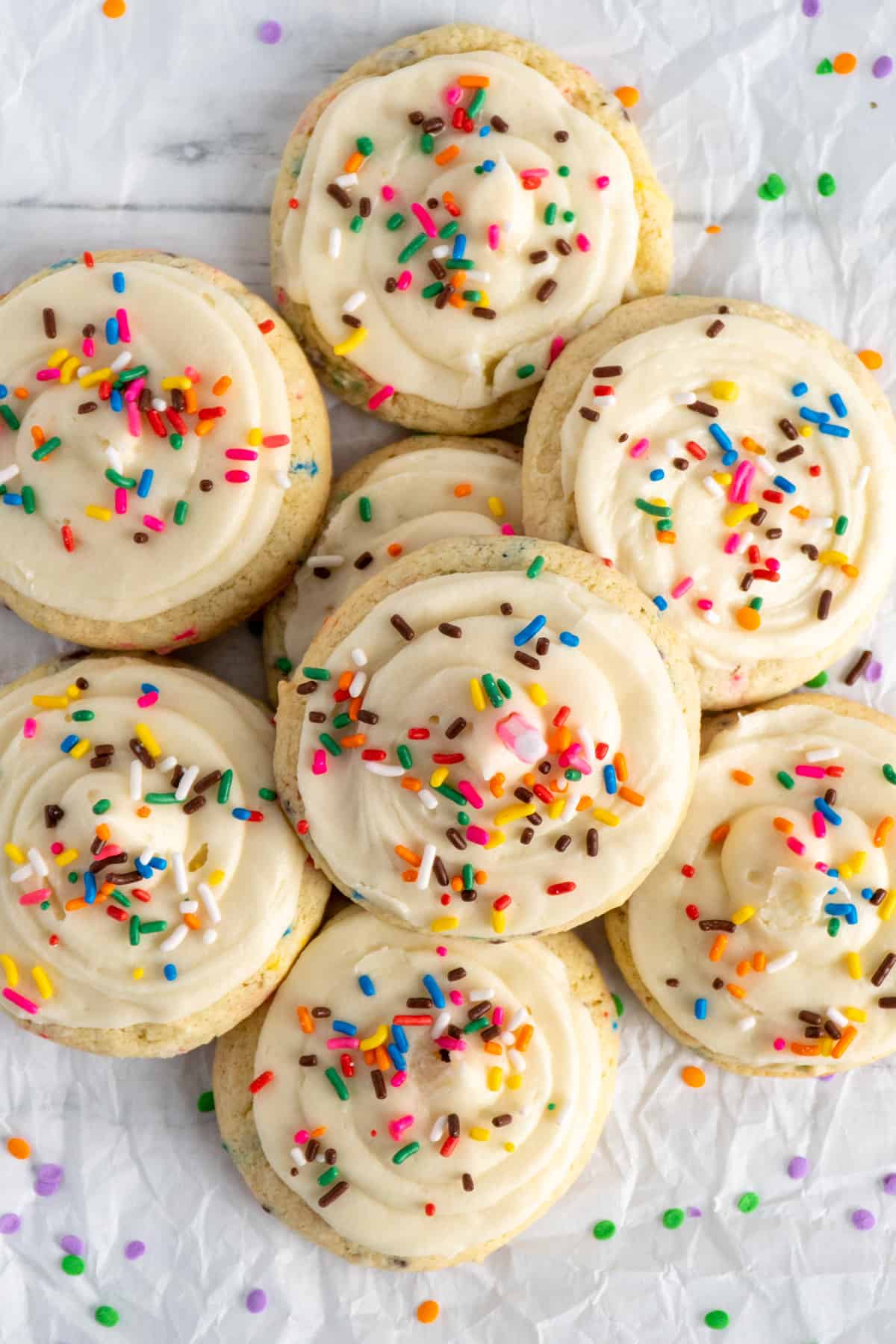 Birthday cake cookies with cake mix stacked on top of each other.