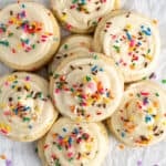Birthday cake cookies with cake mix stacked on top of each other.