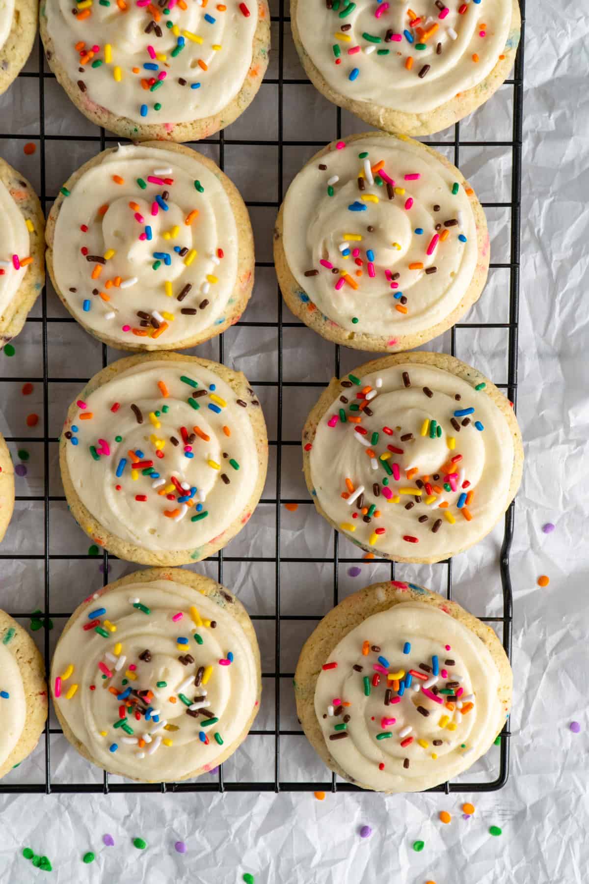 Cake mix cookies with frosting and sprinkles on top.