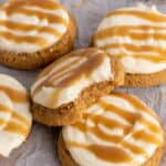 Crumble salted caramel cheesecake cookies with a bite take out of it.