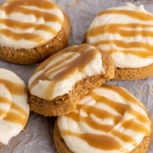Crumble salted caramel cheesecake cookies with a bite take out of it.
