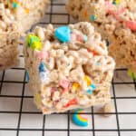 Lucky charm rice krispie treats on a wire rack.