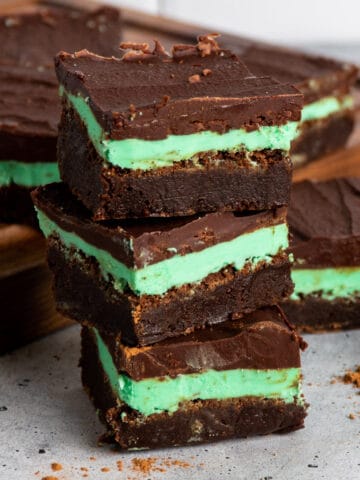 Three mint chocolate brownies stacked on top of each other.