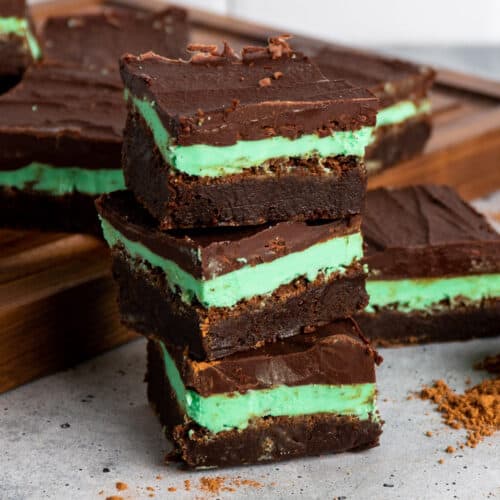 Three mint chocolate brownies stacked on top of each other.