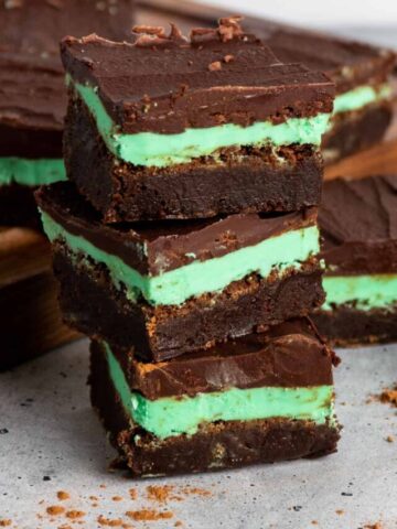 Three mint chocolate brownies stacked on top of each other.