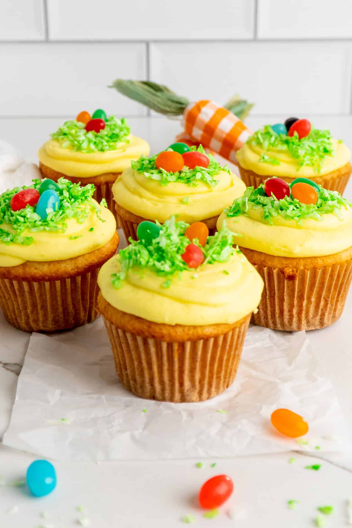Close-up of a Easter egg cup cake with jelly beans on top.