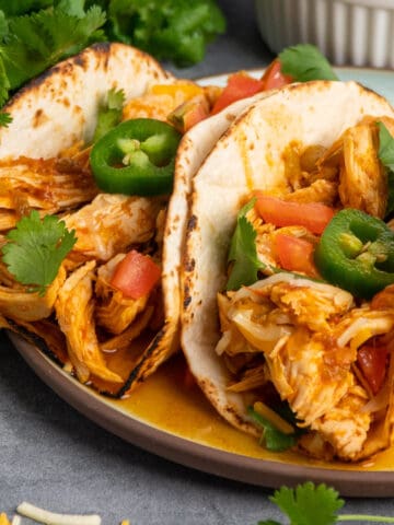 Close up of Instant pot chicken tacos on a plate.