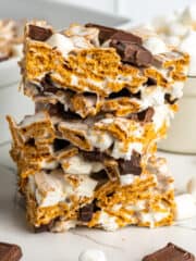 Three Golden Graham s'mores bars stacked on top of each other.