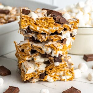 Three Golden Graham s'mores bars stacked on top of each other.