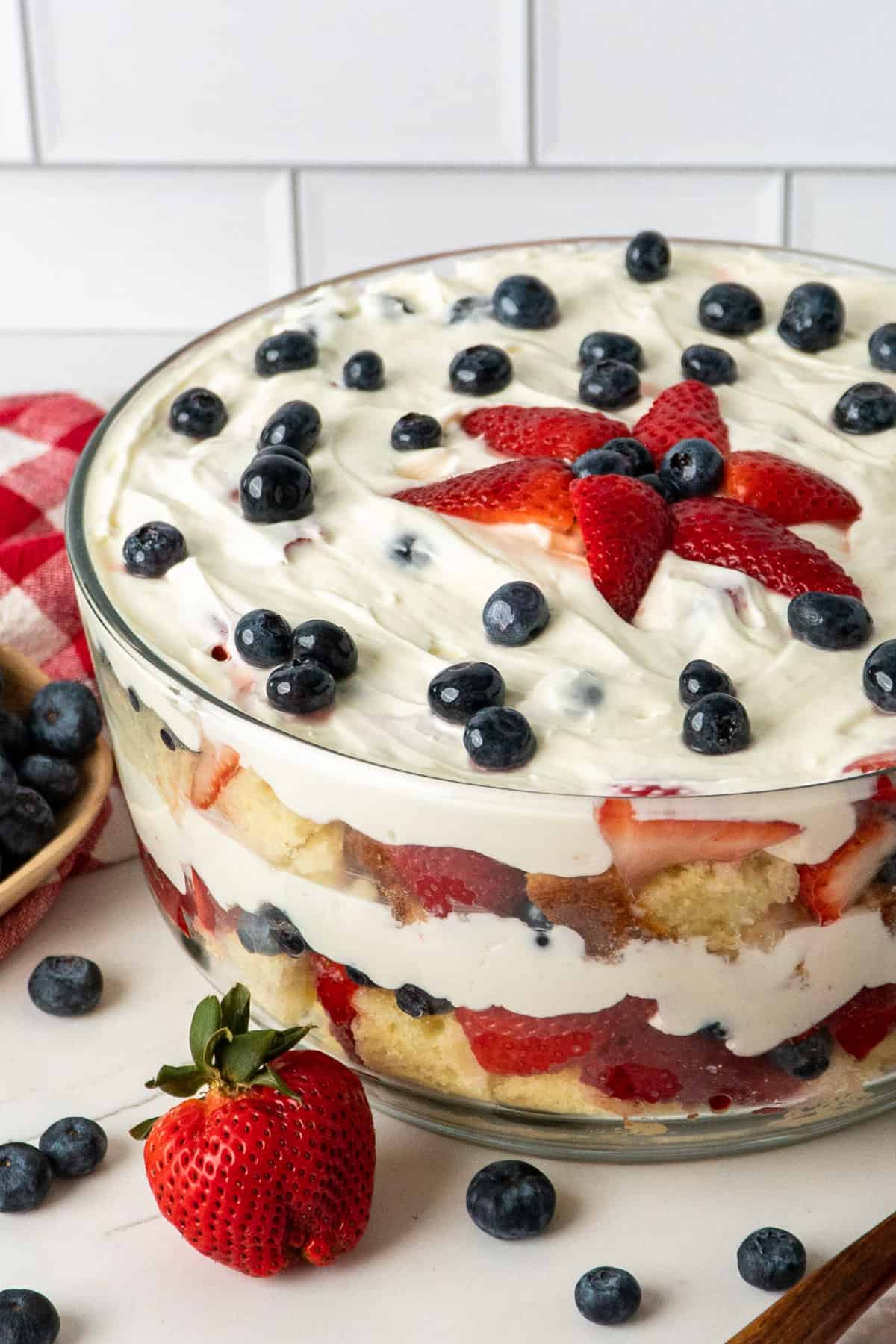 A fun summer dessert in with berries in a glass bowl.