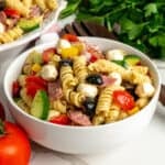 Close-up of Italian pasta salad in a small white bowl.