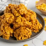 Close-up of peanut butter cornflake cookies on a plate.