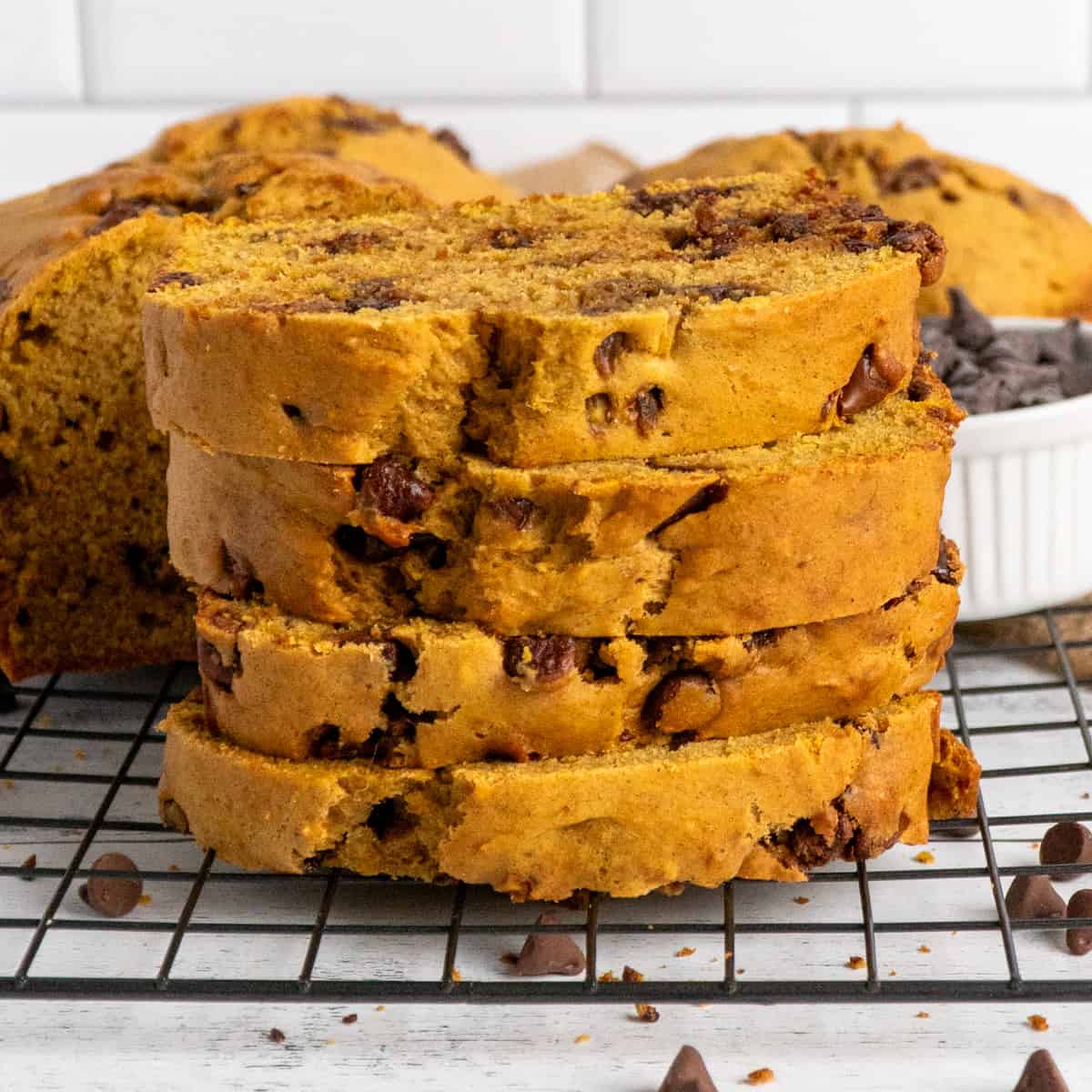 Pumpkin Chocolate Chip bread stack up on a cooling rack.