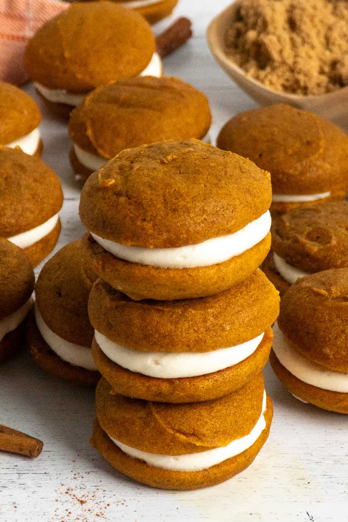 Three pumpkin whoopie pies stacked on top of each other.