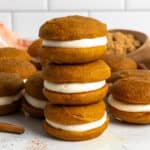 Three pumpkin whoopie pies stacked on top of each other.