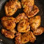 Overhead look at skillet chicken thighs.