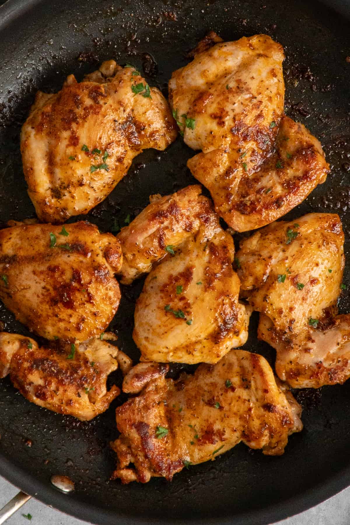 Overhead look at skillet chicken thighs.