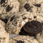 Cookies and cream cookie with a bite taken out of it.