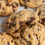 Coconut chocolate chip cookies with a bite taken out of it.