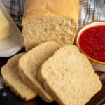 Close up of homemade sandwich bread with three slices cut off.