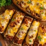 Overhead look at sloppy Joe garlic bread on a wood cutting board.