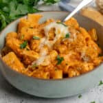 Close up of chicken parmesan pasta in a bowl.