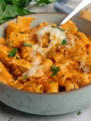 Close up of chicken parmesan pasta in a bowl.
