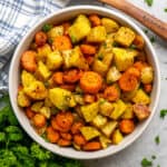 Roasted potatoes and carrots in a bowl.
