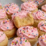 Close up of sugar cookie cups with a bite taken out of one.