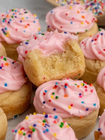 Close up of sugar cookie cups with a bite taken out of one.