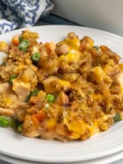 Close up of chicken casserole stuffing on a plate.