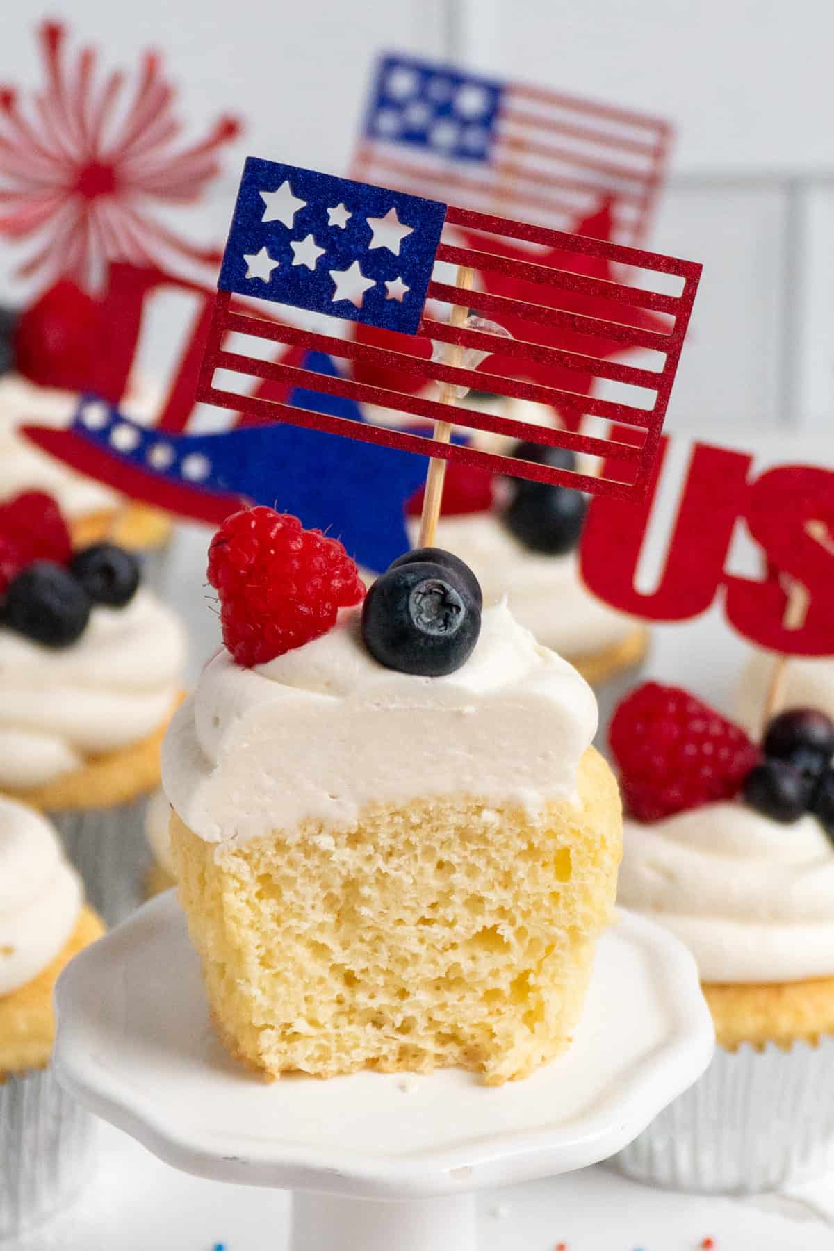 A cupcake with a bite taken out of it.