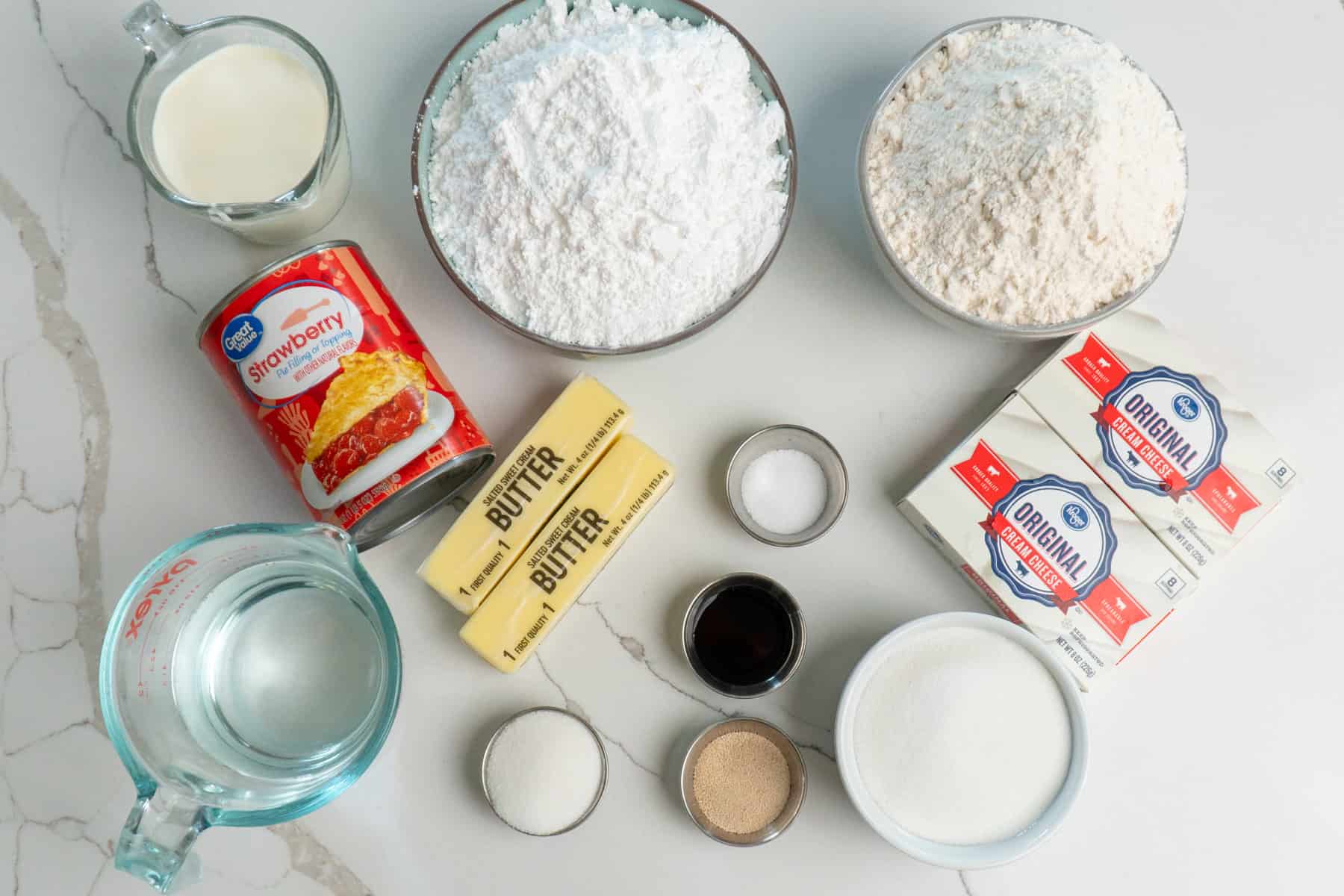 All the ingredients needed to make strawberry cheesecake cinnamon rolls.