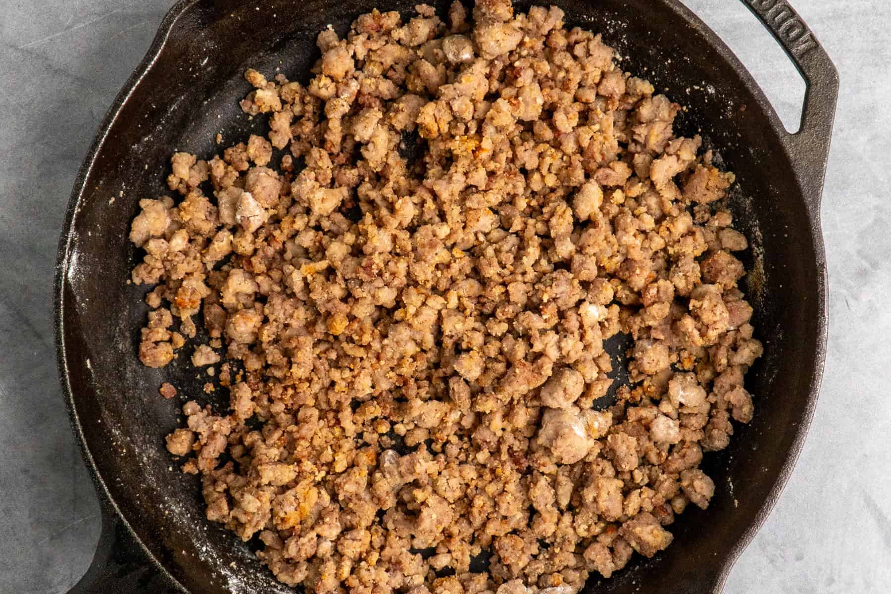 Cooked sausage combined with flour and seasonings.