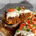 A spatula holding a slice of taco pie.